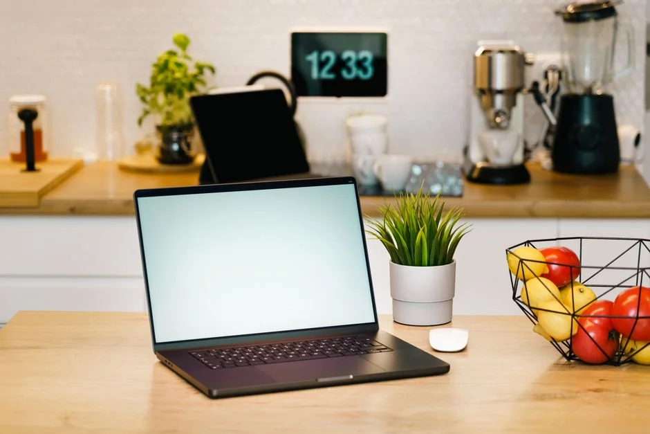 Businesswoman working on laptop with Android 6.0 Marshmallow webpage open.